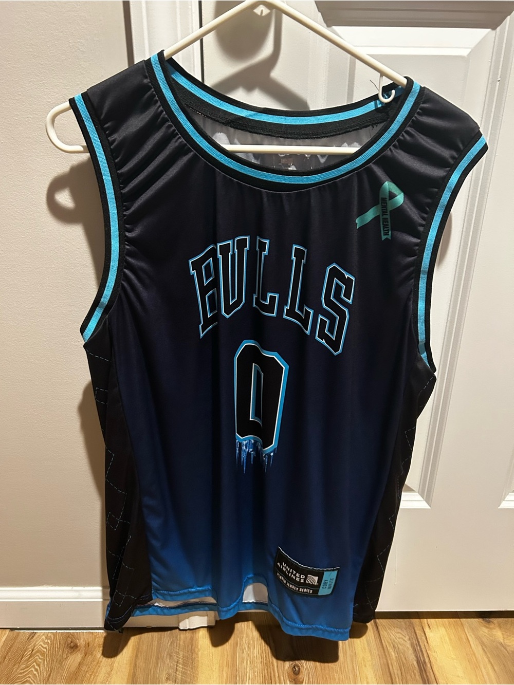 Source Unknown Black and Teal Bulls Basketball Jersey